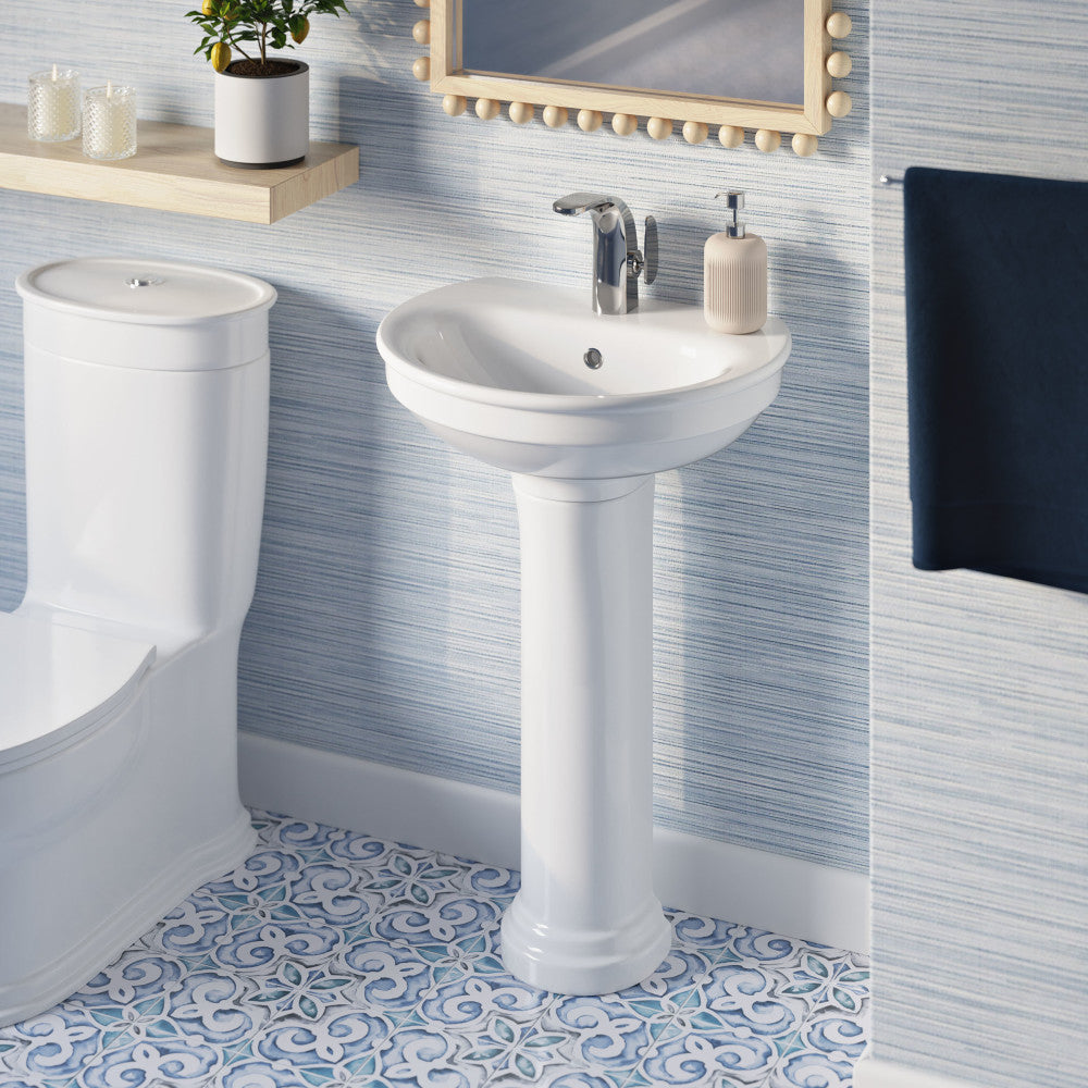 Two-piece white pedestal sink with chrome single-handle faucet and round basin.