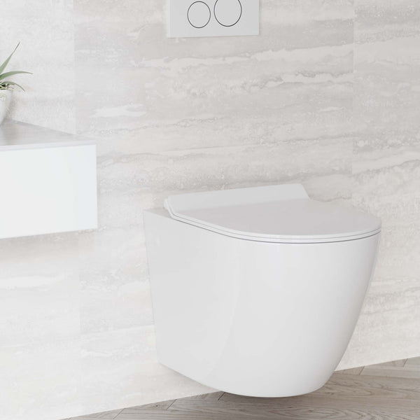 Elongated wall-hung toilet in glossy white with dual flush and white flush plate mounted on beige tiled wall.