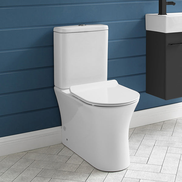 Elongated two-piece toilet with dual-flush buttons, rear outlet, and smooth white ceramic finish.