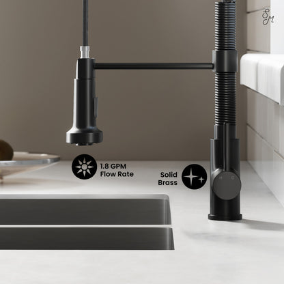 Single handle pull-down kitchen faucet in matte black with flexible spring spout and solid brass construction.