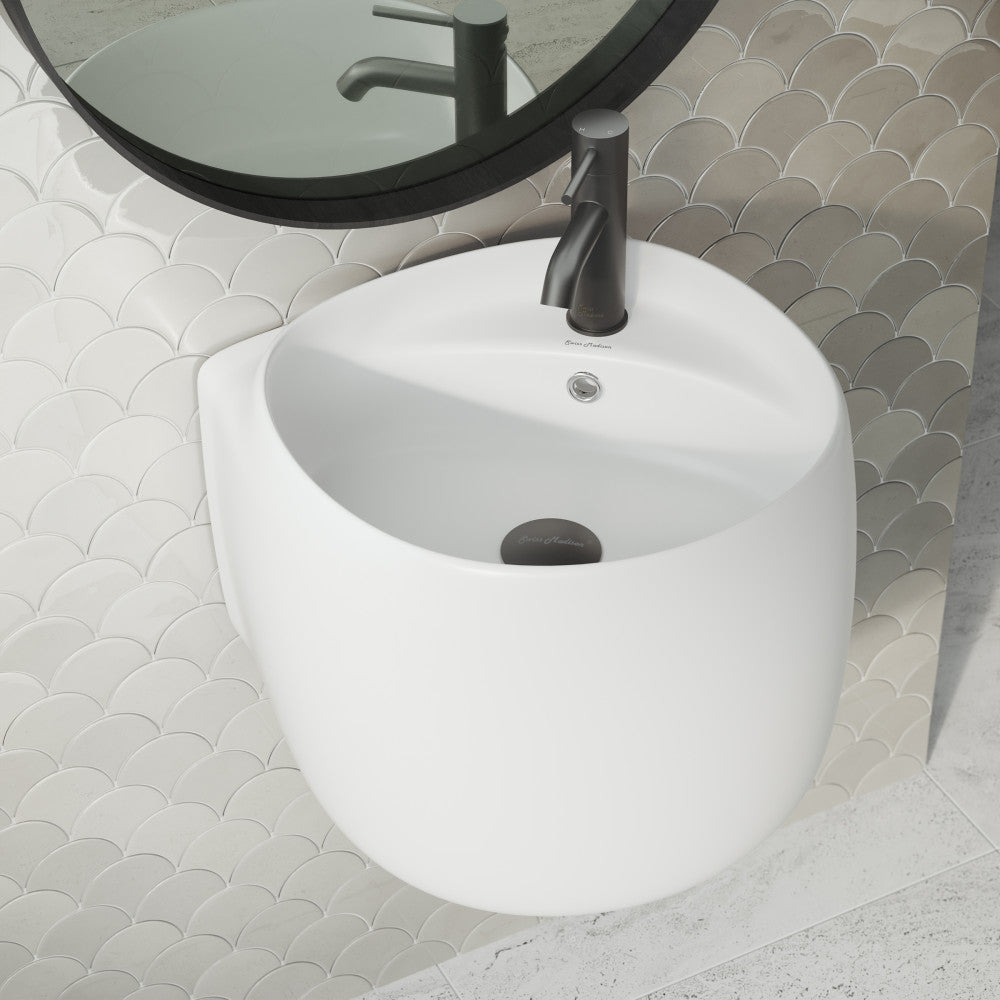 Wall-mount sink in matte white, round bowl design with single-hole faucet and overflow drain.