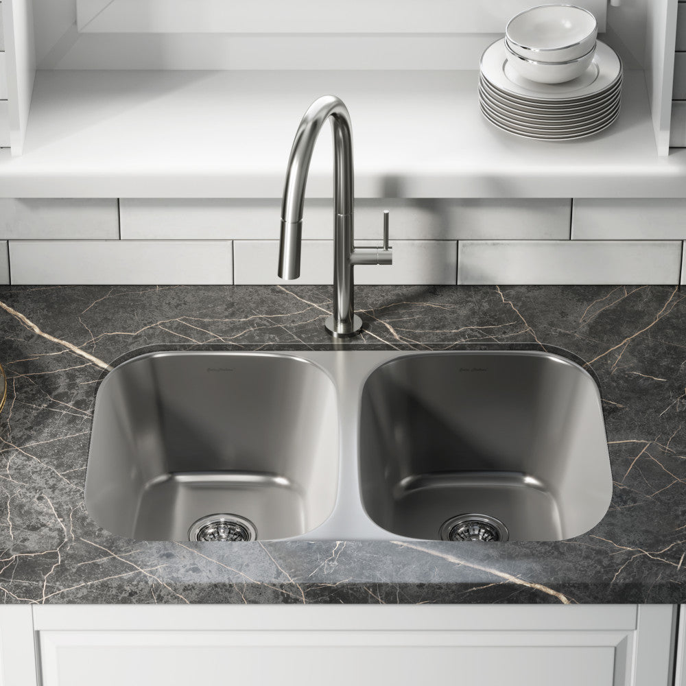 29x18 inch stainless steel undermount kitchen sink with dual basins and modern curved edges.