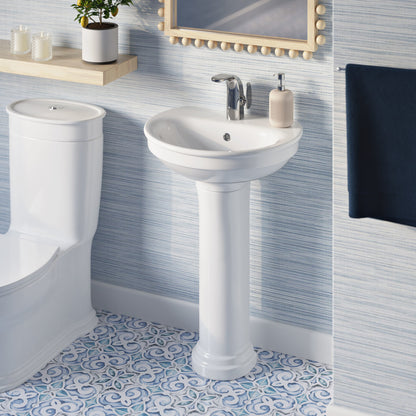 Two-piece white pedestal sink with chrome single-handle faucet and round basin.