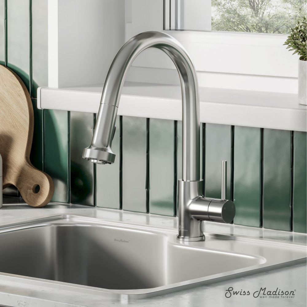 Single handle pull-down kitchen faucet in brushed nickel with high-arc spout and sleek modern design.