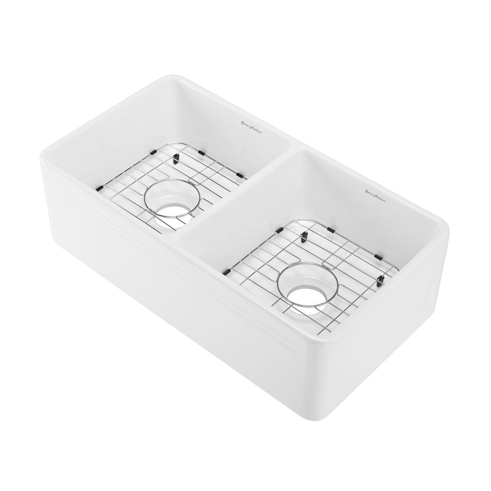 34-inch double basin ceramic farmhouse kitchen sink in glossy white with metal drain grids.