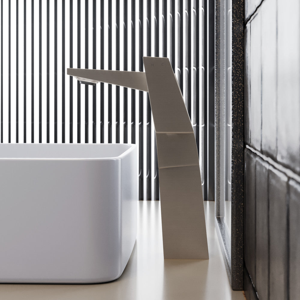 Single-handle high arc bathroom faucet in brushed nickel, modern geometric design.