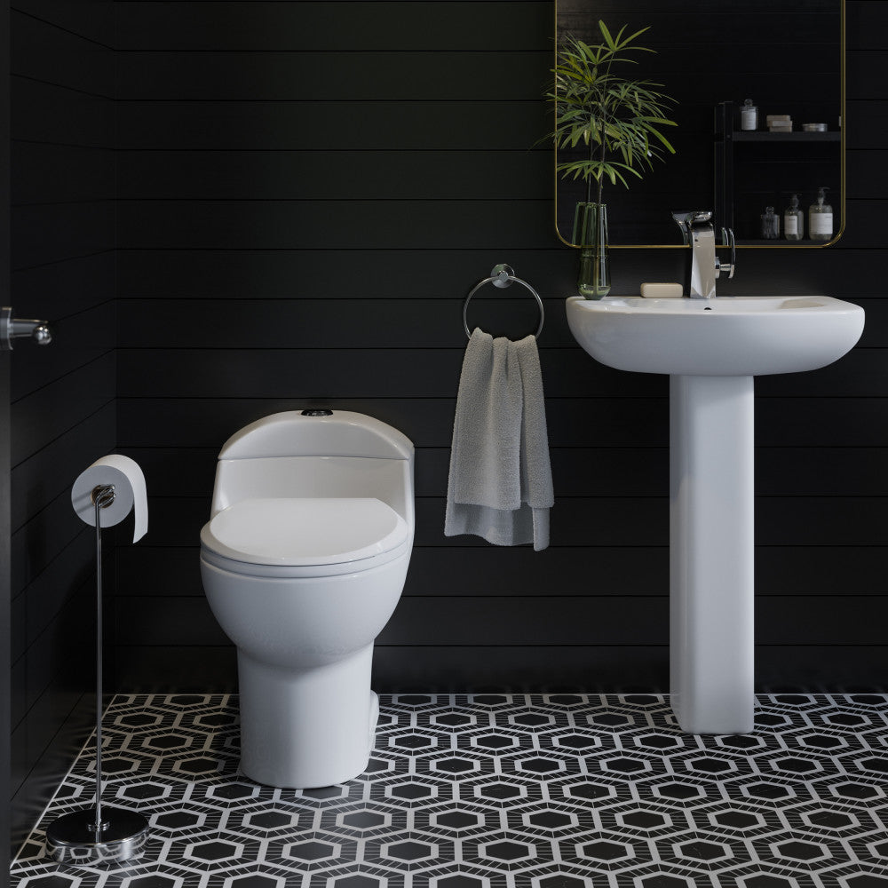 Elongated one-piece white toilet with dual flush, classic design in modern bathroom setting.