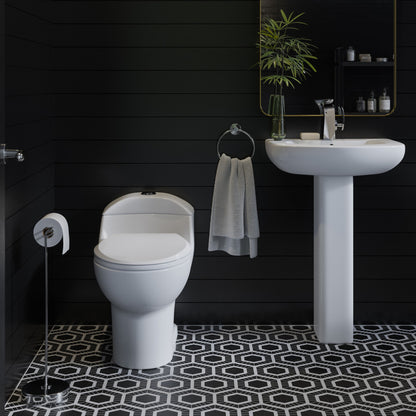Elongated one-piece white toilet with dual flush, classic design in modern bathroom setting.