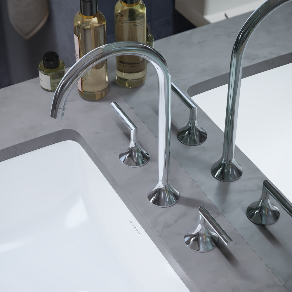 Widespread bathroom faucet in chrome with two handles and curved spout on marble countertop.