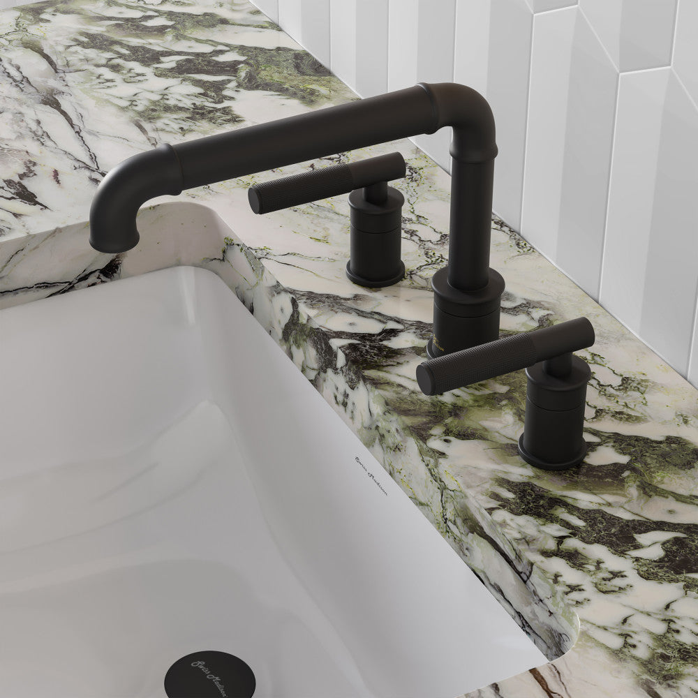 Widespread bathroom faucet in matte black with sleek handles, installed on marble countertop above white sink.