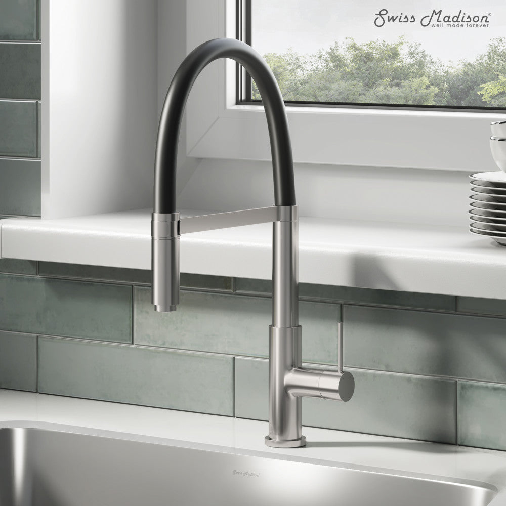 Single handle pull-down kitchen faucet in brushed nickel with a high arc spout.