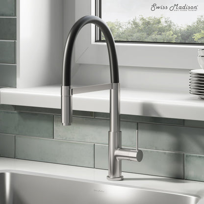 Single handle pull-down kitchen faucet in brushed nickel with a high arc spout.