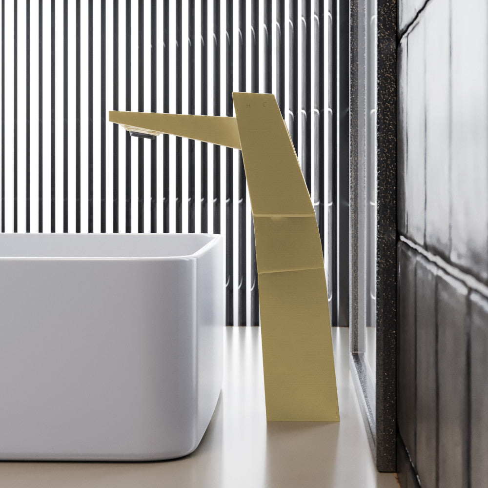 Single-handle high arc bathroom faucet in brushed gold, modern angular design.