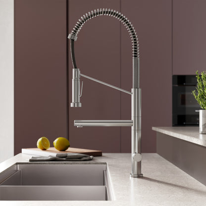 Single handle pull-down kitchen faucet in brushed nickel with pot filler and spring spout.
