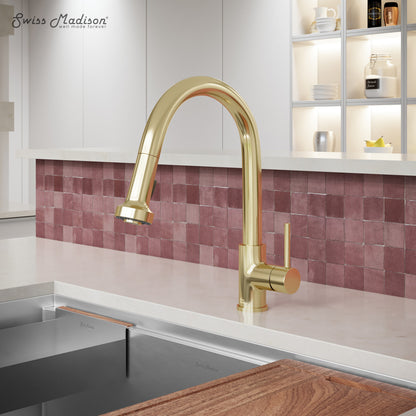 Single handle pull-down kitchen faucet in brushed gold with high-arc spout and side lever handle.