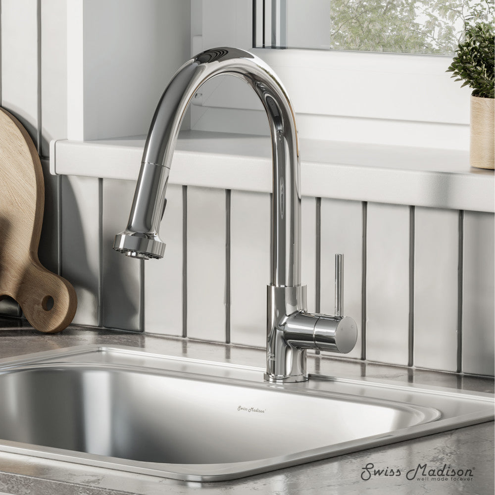Single handle pull-down kitchen faucet in chrome with curved spout and side lever handle.