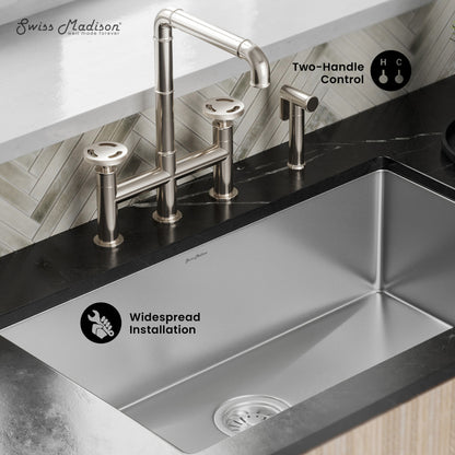 Widespread kitchen faucet in brushed nickel with two handles and side sprayer installed on countertop.