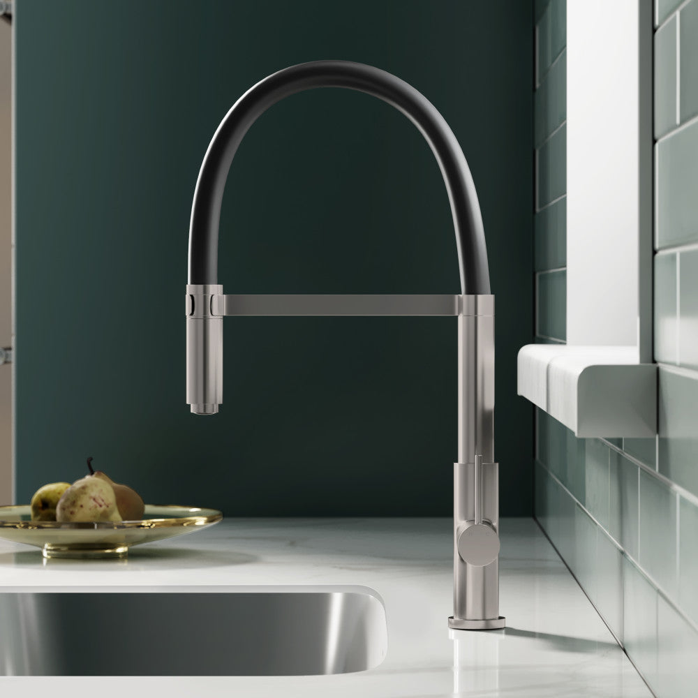 Single handle pull-down kitchen faucet in brushed nickel with curved gooseneck design.