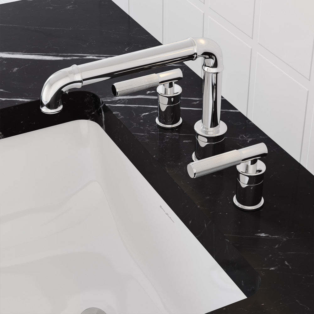 Widespread bathroom faucet in polished chrome with sleek cylindrical handles on black marble countertop.