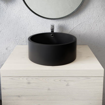 16.5” round vessel sink in matte black with single-hole faucet mount and overflow drain.