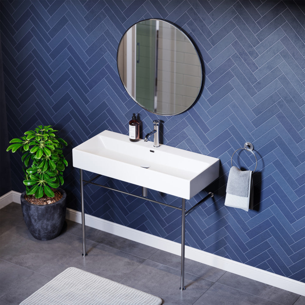 White ceramic console sink with chrome legs and integrated single faucet hole, modern rectangular basin.