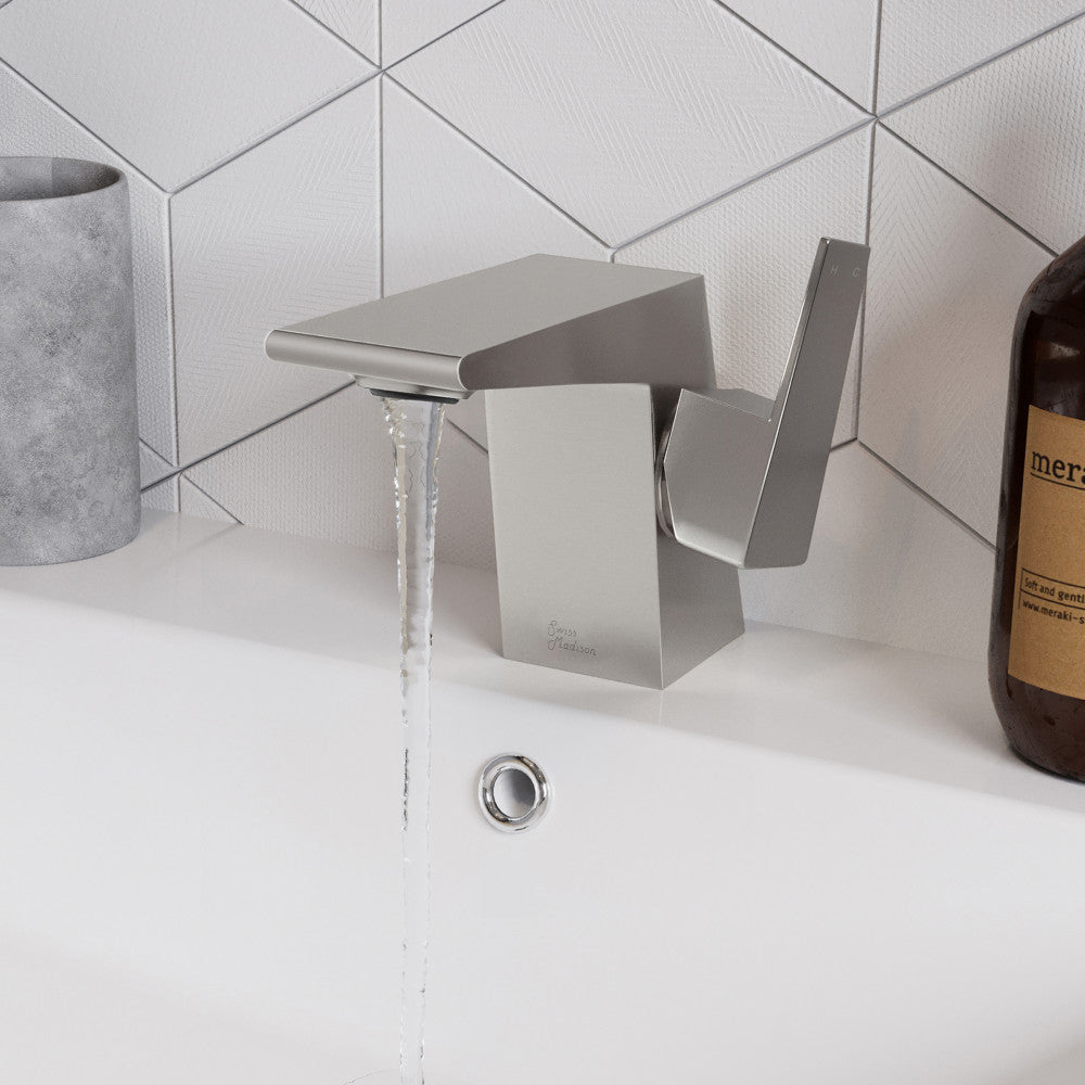Single-handle bathroom faucet in brushed nickel, modern square design with flowing water.