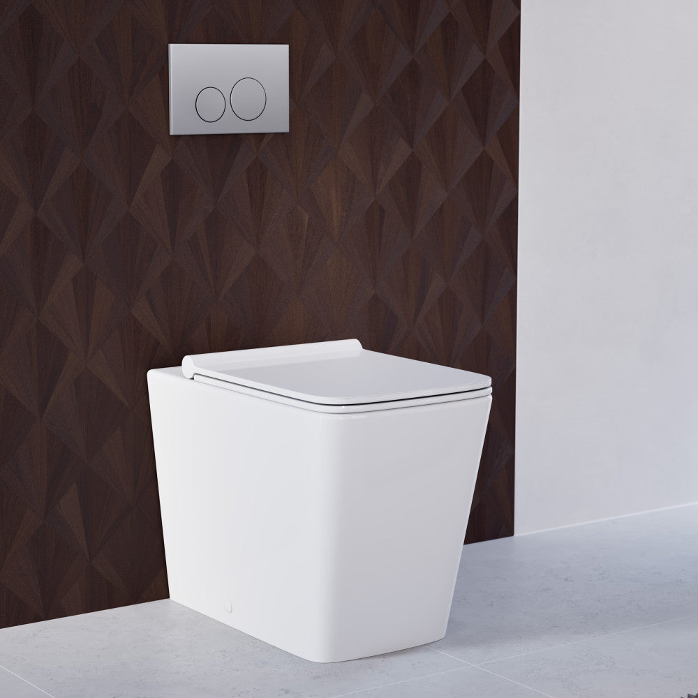 Elongated back-to-wall toilet with concealed tank in glossy white, soft-close seat.
