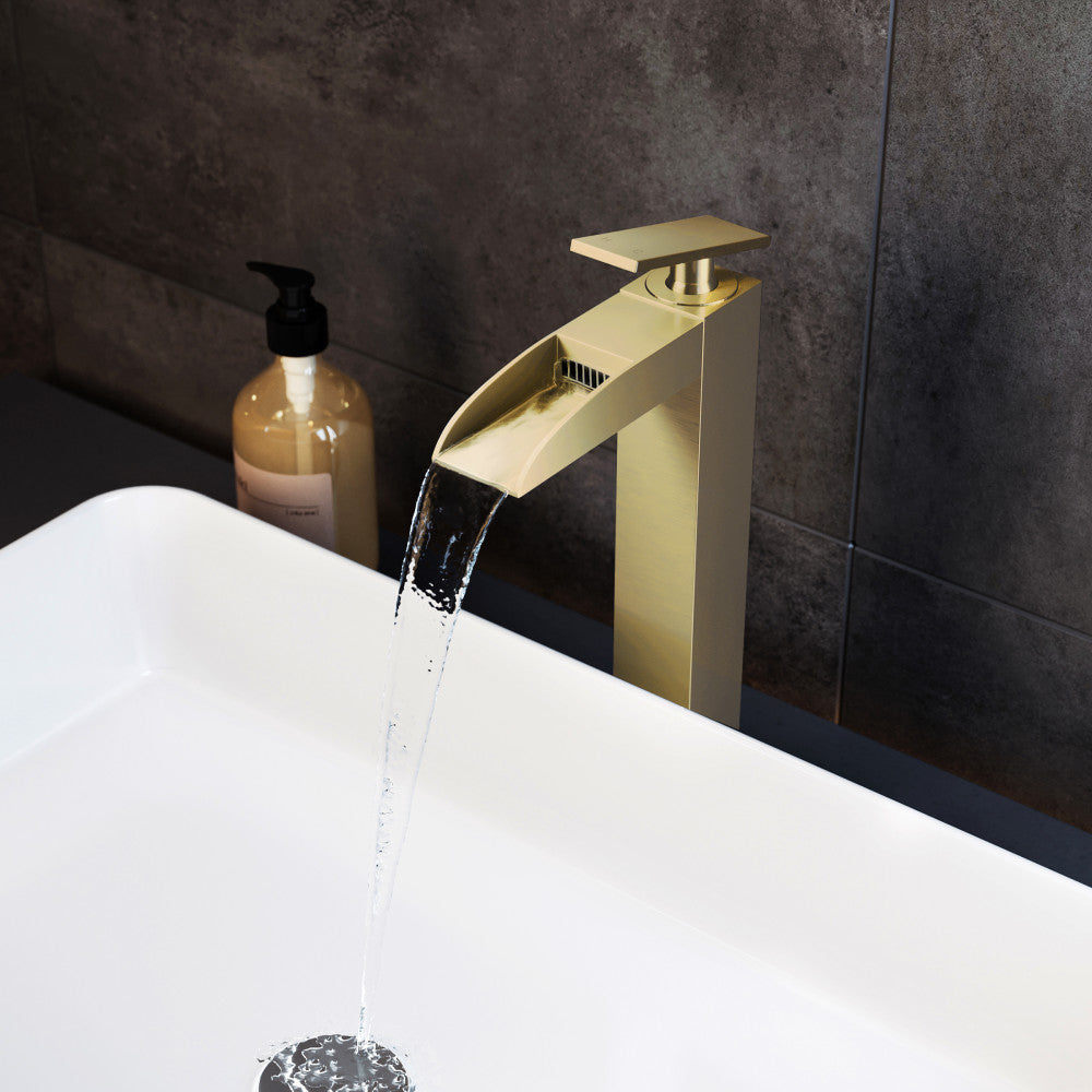 Single-handle bathroom faucet in brushed gold with high arc waterfall spout.