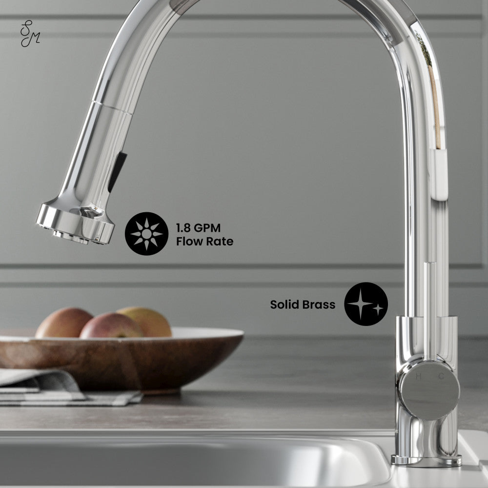 Single handle pull-down kitchen faucet in chrome with high arc spout and round spray head.