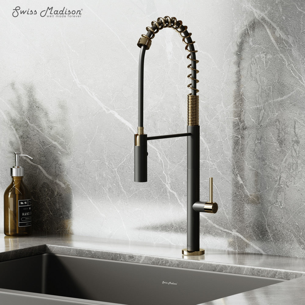 Pull-down kitchen faucet in brushed gold and black, single handle with flexible coil spring neck.