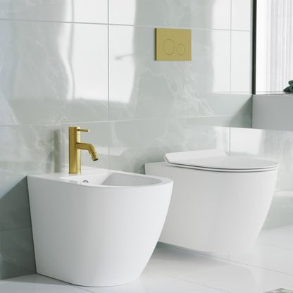 Single-handle bidet faucet in brushed gold with minimalist cylindrical design.