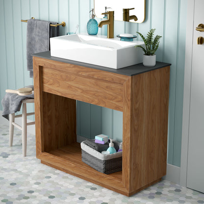 36-inch freestanding bathroom vanity in natural teak with single sink and black countertop.