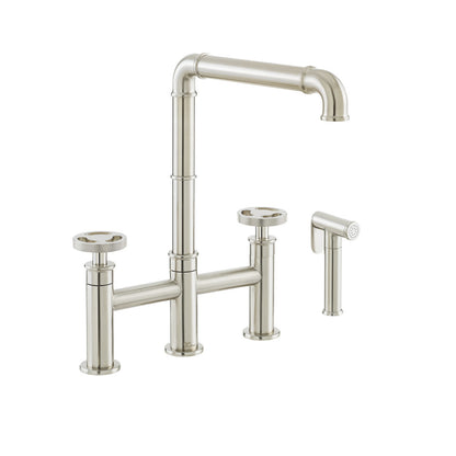 Widespread kitchen faucet in brushed nickel with side sprayer and tall arched spout.