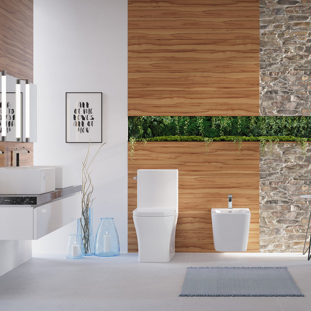 Elongated one-piece white toilet with left-hand flush in modern bathroom setting.