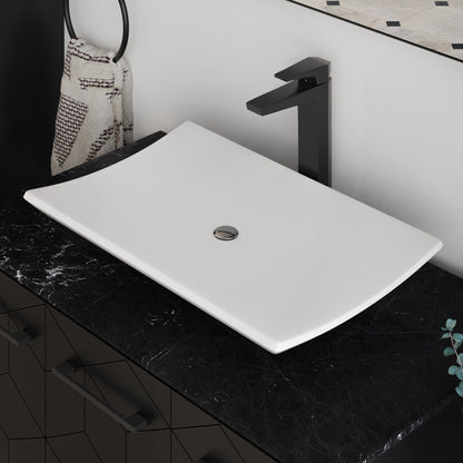 23.5” white rectangular vessel bathroom sink with smooth curved edges on black marble countertop.