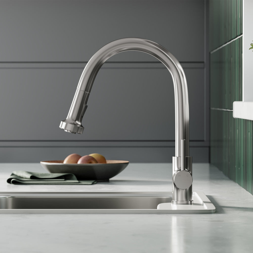 Single-handle pull-down kitchen faucet in brushed nickel with high-arc spout and sleek modern design.
