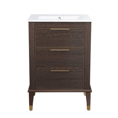24-inch freestanding bathroom vanity in brown oak, single sink, soft-close drawers, brass handles and leg caps.