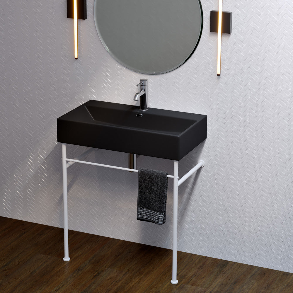 Matte black rectangular ceramic console sink with matte white slim legs and single-hole faucet mount.