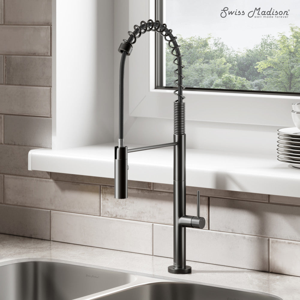 Pull-down kitchen faucet in matte black, single handle, spring coil neck design.