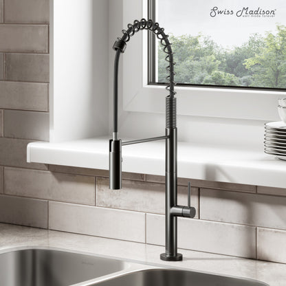 Pull-down kitchen faucet in matte black, single handle, spring coil neck design.