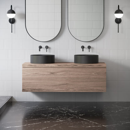 16.5" round vessel bathroom sink in matte black, countertop installation.