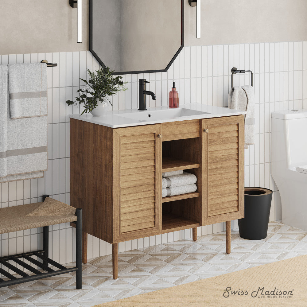 36-inch freestanding wooden bathroom vanity in golden oak, single sink, two doors, open middle shelves.