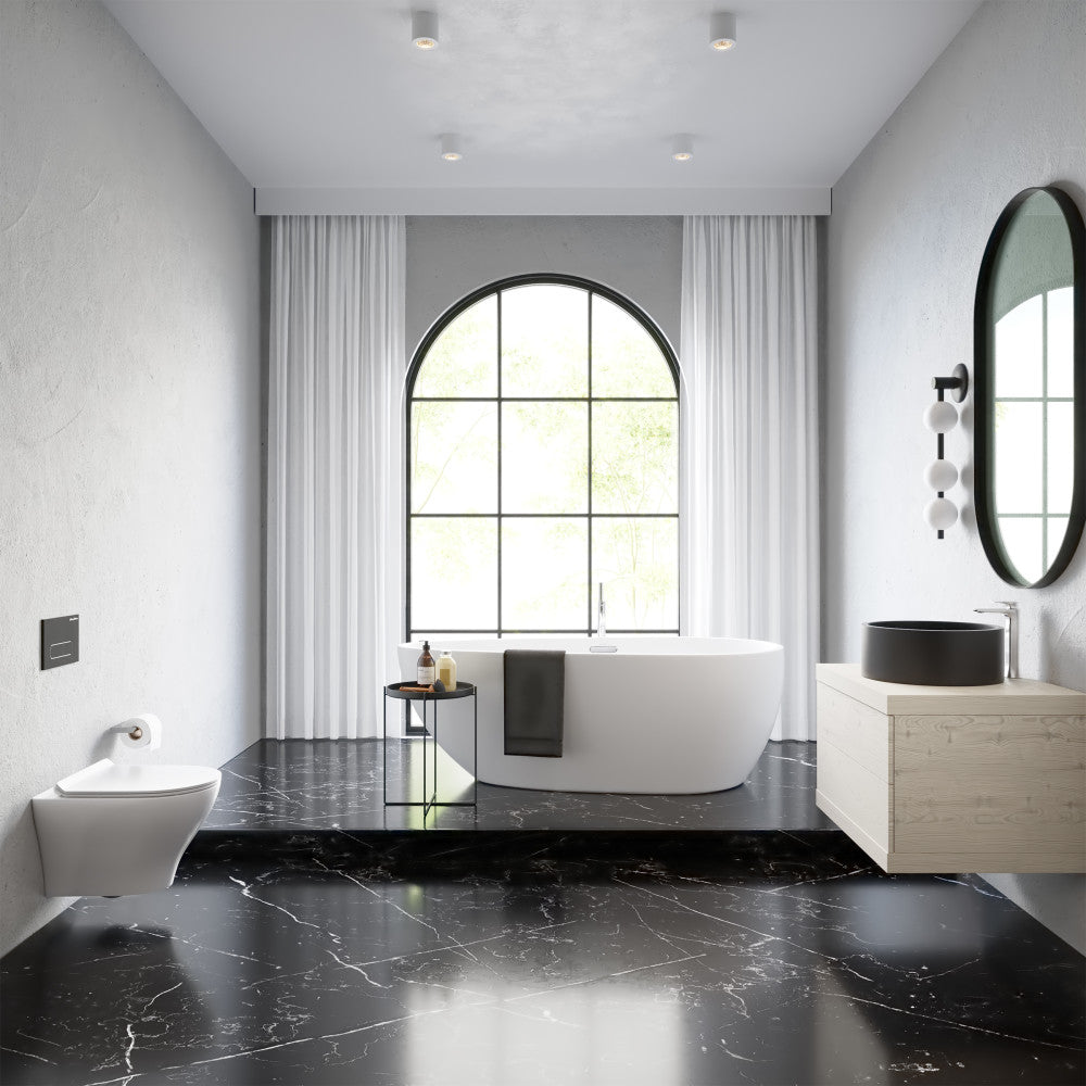 Round wall-hung toilet bowl in white ceramic, modern minimalist bathroom setting.