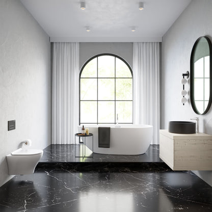 Round wall-hung toilet bowl in white ceramic, modern minimalist bathroom setting.