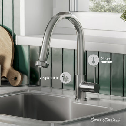 Single-handle pull-down kitchen faucet in brushed nickel with curved spout and spray head.