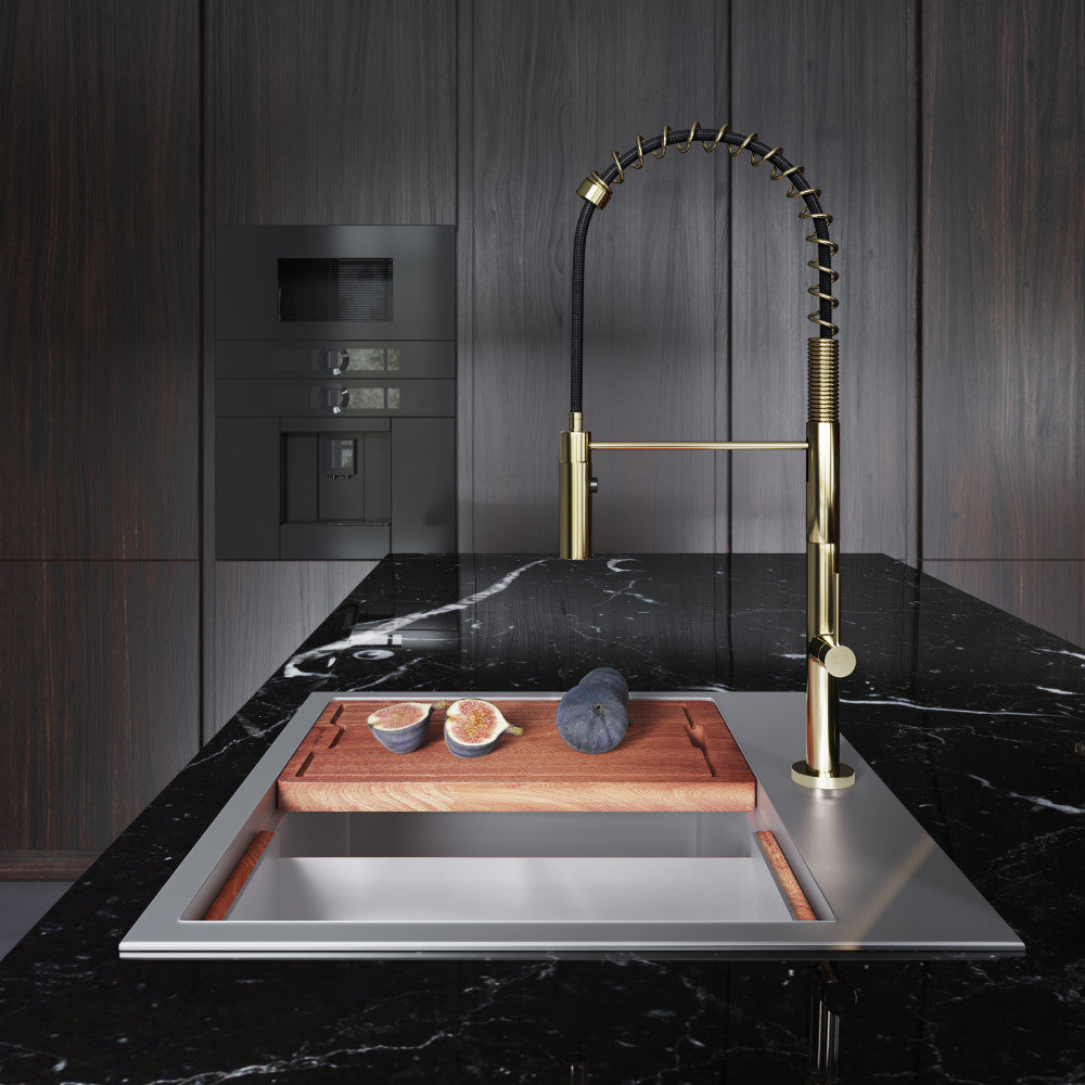 Single handle pull-down kitchen faucet in brushed gold with high arc spring spout.