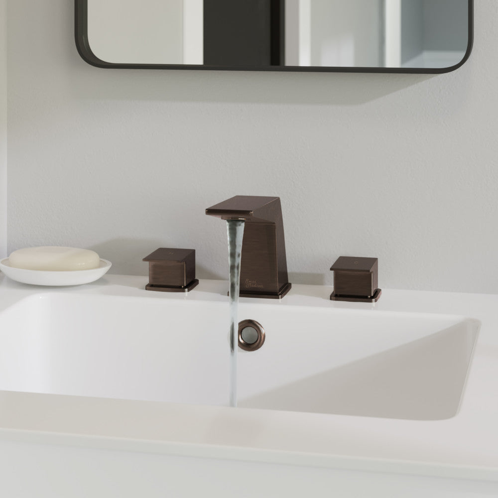 Widespread 2-handle bathroom faucet in oil rubbed bronze with angular spout and lever handles.