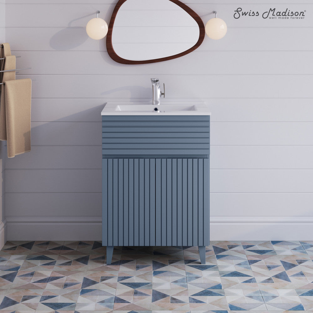 24-inch freestanding bathroom vanity in blue heather with single sink and grooved cabinet doors.
