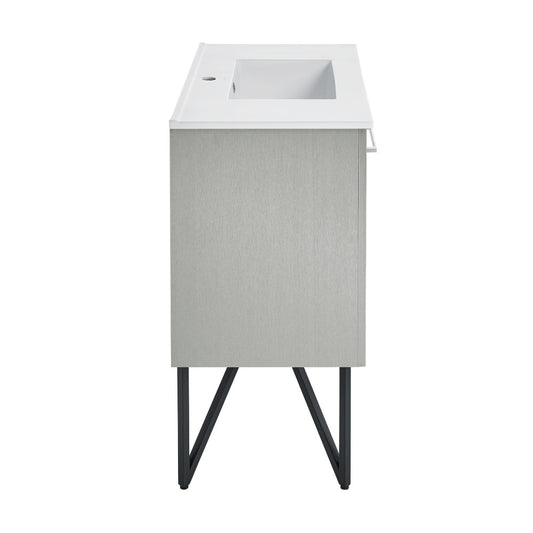 36-inch freestanding gray bathroom vanity with white sink top and metal leg supports.