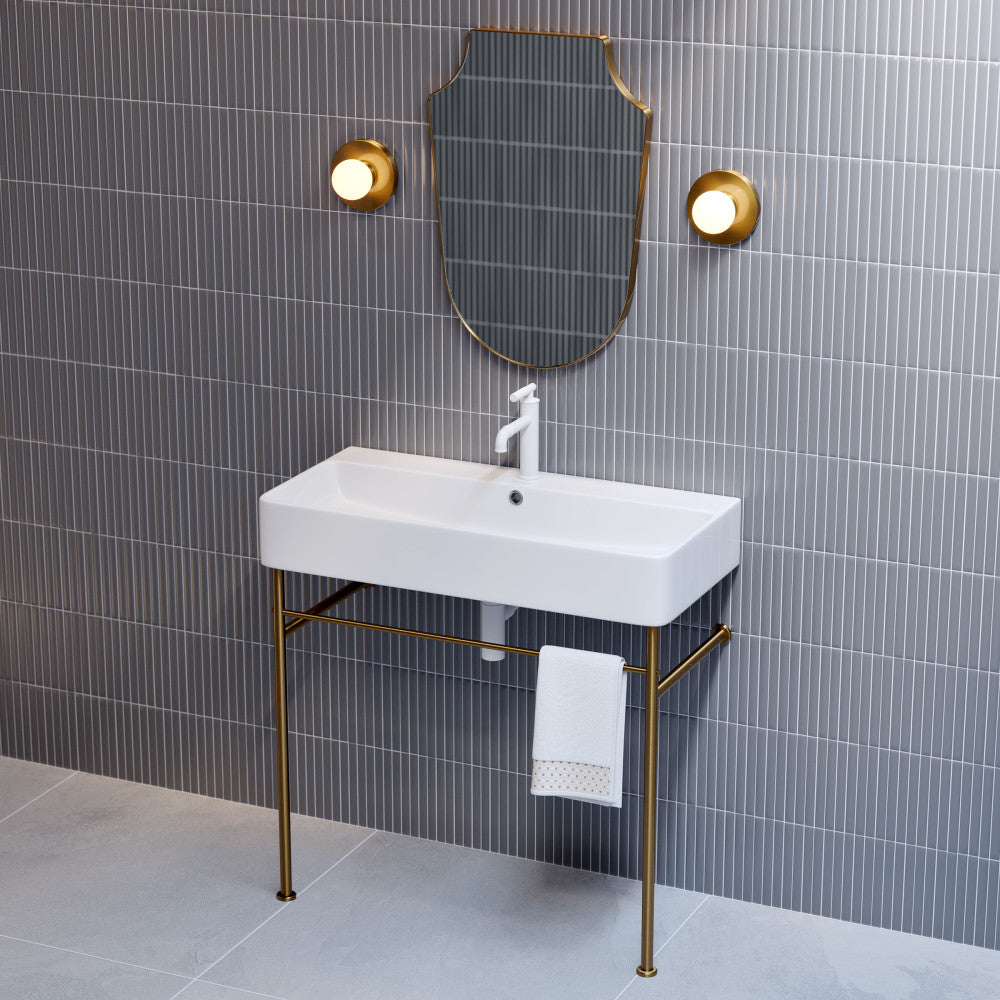 36-inch white ceramic console sink with brushed gold legs and single faucet hole.